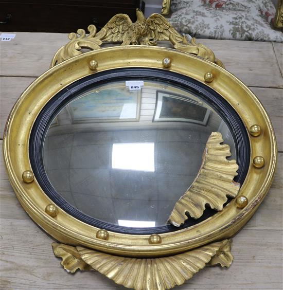 A Regency convex mirror with acanthus and eagle surmount H.3ft.